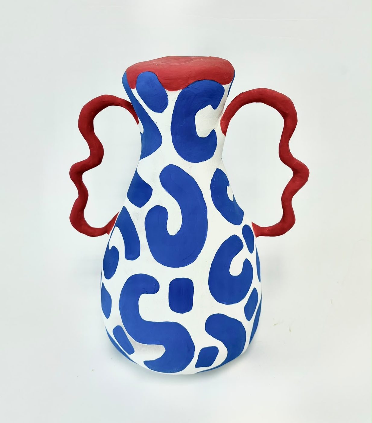 Hand-painted ceramic vase in white, blue and red
